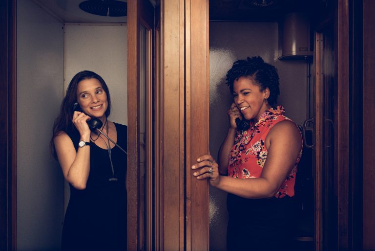 Resolve Philly Co-Founders Jean Friedman-Rudovsky and Cassie Haynes posed in front of a brick wall