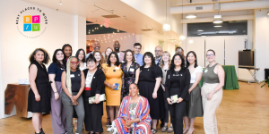 A photo of Resolve staff with the Philadelphia Business Journal Best Workplaces logo in the top left corner